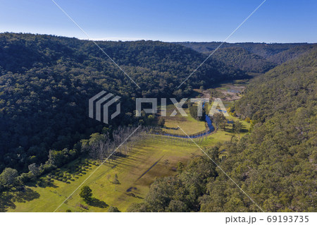 A fresh water creek running through a valley in Australia 69193735