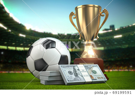 Betting, Footbal ball and cup with packs of dollar on football a Betting, Footbal ball and cup with packs of dollar on football a 69199591
