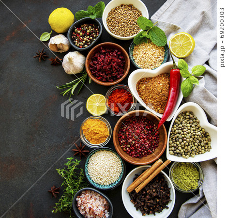 Various spices in a bowls on a black Various spices in a bowls on a black 69200303