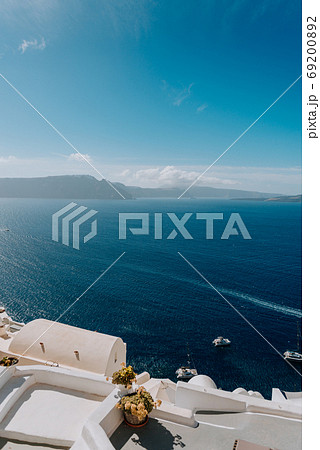 Oia Santorini Greece famous with romantic and beautiful sunsets. Oia village in Santorini island.Greece. 69200892