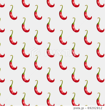 Red hot chilli pepper on a light background Red hot chilli pepper on a light background 69202812