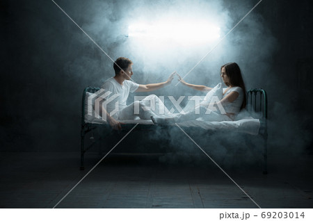 Crazy man and woman are sitting in bed, insomnia 69203014