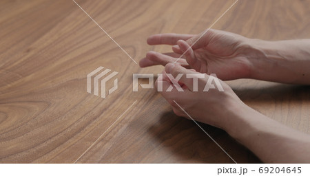 man hand suggestions gesture on black walnut table man hand suggestions gesture on black walnut table 69204645