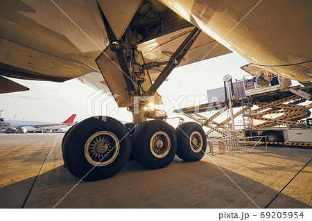 Loading of cargo containers to airplane Loading of cargo containers to airplane 69205954