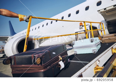 Loading of luggage to airplane Loading of luggage to airplane 69205958
