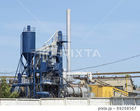 Horizontal photo of a blue industrial building on a factory. Concrete factory Horizontal photo of a blue industrial building on a factory. Concrete factory 69208567
