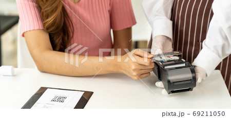 Panoramic Close up Asian woman customer make contactless credit 69211050