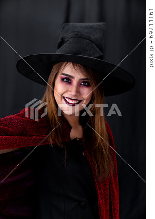 Portrait of asian woman in halloween cloth Portrait of asian woman in halloween cloth 69211161
