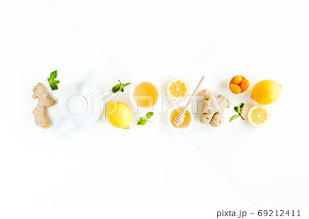 Herbal tea with mint, ginger, lemon, honey and other herbs on white background. Flat lay, top view. 69212411
