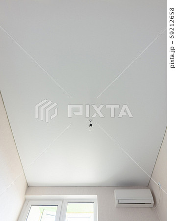 Matte vinyl stretch ceiling in the interior of the room Matte vinyl stretch ceiling in the interior of the room 69212658