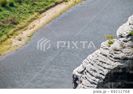 A lonely canoe team on the river Elbe 69212708