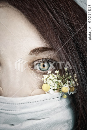 Young attractive woman in floral face mask Young attractive woman in floral face mask 69214818