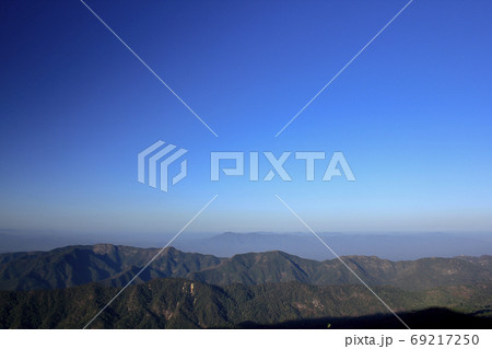 Landscape mist-covered mountains in the morning. Landscape mist-covered mountains in the morning. 69217250
