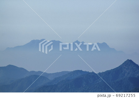 Landscape mist-covered mountains in the morning. 69217255