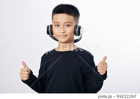 Vietnamese boy in headphones Vietnamese boy in headphones 69222267