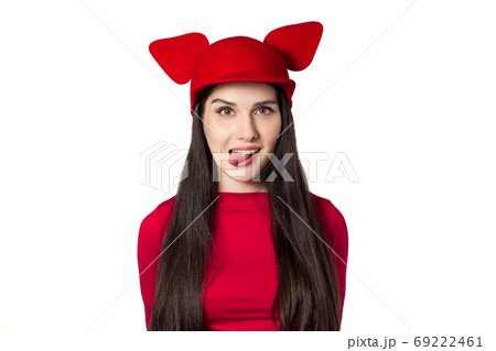 Playful white black haired beautiful young woman with mouse ears hat Playful white black haired beautiful young woman with mouse ears hat 69222461