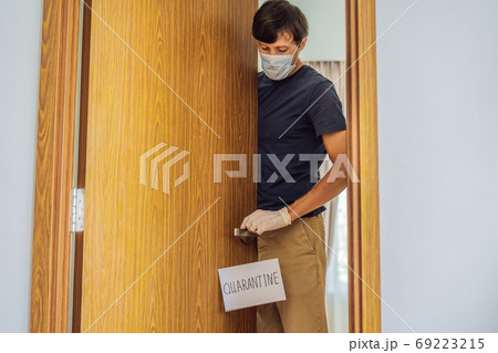 Coronavirus covid-19 quarantine sign at Front door, quarantine sign at home Coronavirus covid-19 quarantine sign at Front door, quarantine sign at home 69223215