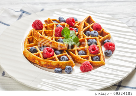 oatmeal banana waffles with berries, top view 69224185