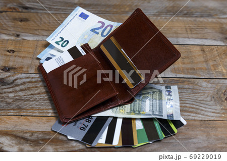 Banknotes, euro coins and credit cards Banknotes, euro coins and credit cards 69229019