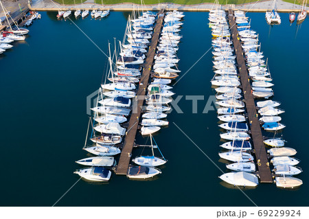Boats moored at dock in Lovere port Boats moored at dock in Lovere port 69229924