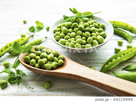 Green peas in white bowl Green peas in white bowl 69229999