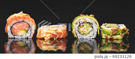Sushi roll set on black glass background Sushi roll set on black glass background 69233126