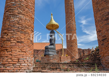The Black buddha head or Rahu in a temple in Phra Nakhon Si Ayut The Black buddha head or Rahu in a temple in Phra Nakhon Si Ayut 69234030