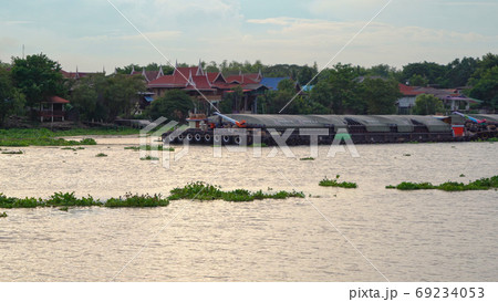 A cargo ship passing through on Chao Phraya River or sea with co A cargo ship passing through on Chao Phraya River or sea with co 69234053