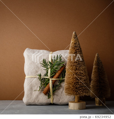 Fabric wrapped gifts, Zero waste beauty body care and house cleaning items and wooden Christmas decorations 69234952