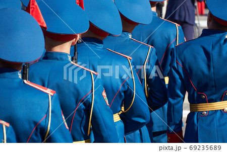 military parade in a city, soldiers in full dress uniforms ordered in parade formation 69235689