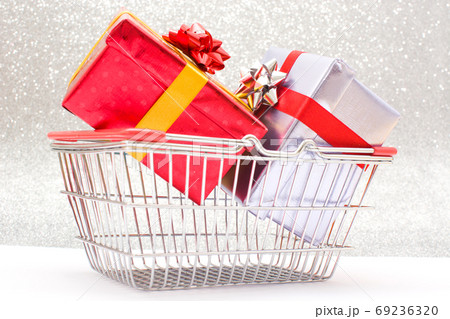 Gift boxes in a basket Gift boxes in a basket 69236320