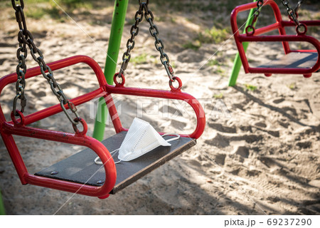 Mask placed on the swing. concept of coronavirus epidemic 69237290