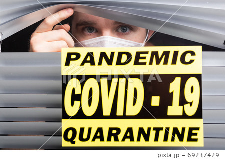 Hospital quarantine or isolation of patient standing alone in room with hopeful for treatment of Coronavirus COVID-19 Pandemic, Outbreak Efforts prevent virus spreading hazard controls concept. 69237429