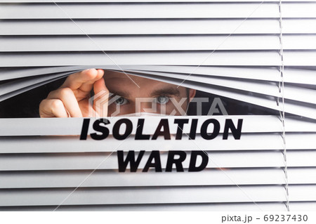 Hospital quarantine or isolation of patient standing alone in room with hopeful for treatment of Coronavirus COVID-19 Pandemic, Outbreak Efforts prevent virus spreading hazard controls concept. 69237430