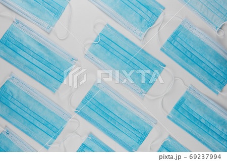 Medical masks on the blue colored background Medical masks on the blue colored background 69237994