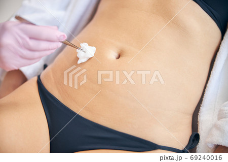 Doctor preparing a woman for a medical procedure Doctor preparing a woman for a medical procedure 69240016