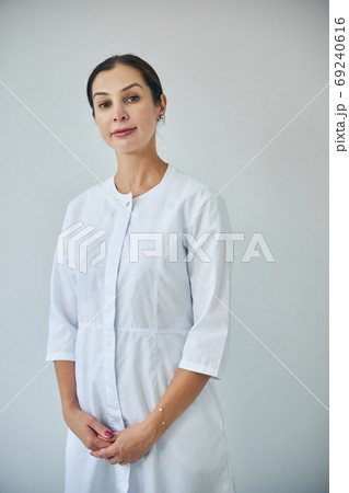 Professional dermatologist staring in front of her Professional dermatologist staring in front of her 69240616