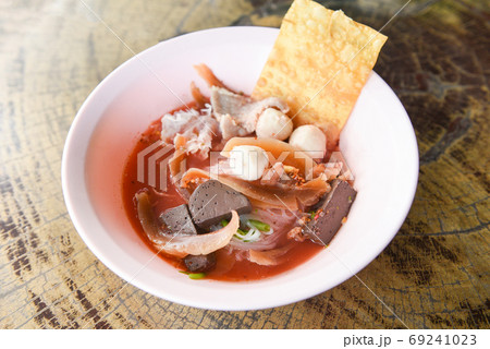 Noodles with seafood on red soup - hot and spicy thai food noodl 69241023