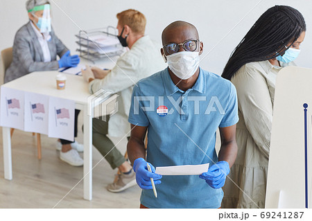 African-American Man Voting in Pandemic African-American Man Voting in Pandemic 69241287