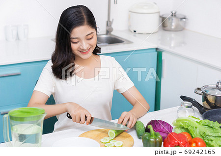 Woman cooking Woman cooking 69242165