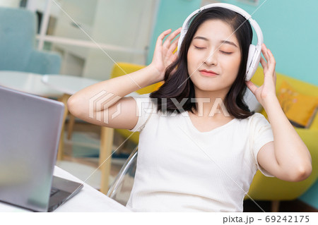 Woman relaxing at home Woman relaxing at home 69242175