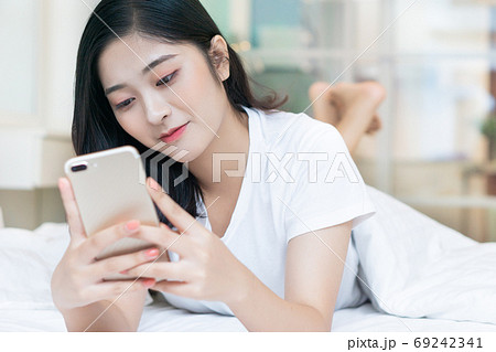 Woman on bed Woman on bed 69242341