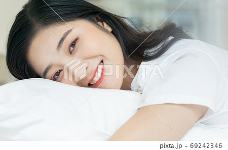 Woman on bed 69242346