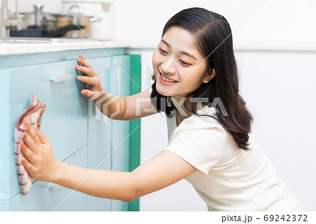 Woman housecleaning Woman housecleaning 69242372