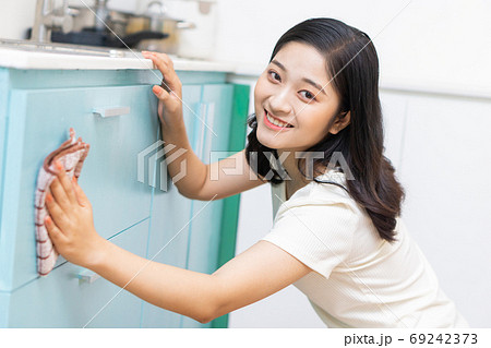 Woman housecleaning Woman housecleaning 69242373