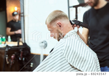 Man at the barber shop 69243547