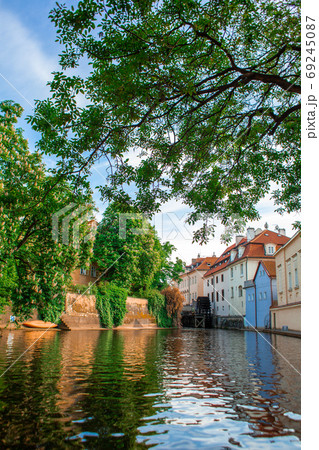 The architecture of the strago city of Prague. River channel in the city. Streets of old Europe, cityscape The architecture of the strago city of Prague. River channel in the city. Streets of old Europe, cityscape 69245087