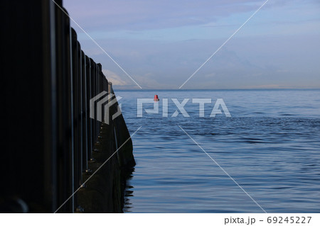 Jetty and Red Buoy at a Coastal Location in Winter 69245227