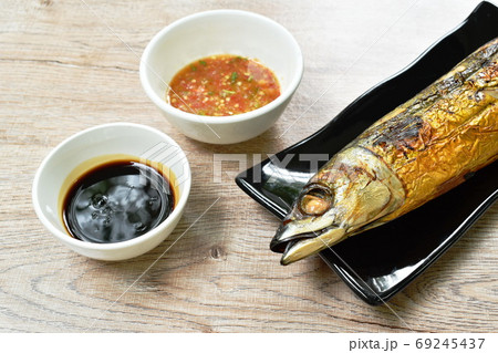 grilled saba fish or mackerel on plate dipping black sweet soybean and spicy sauce grilled saba fish or mackerel on plate dipping black sweet soybean and spicy sauce 69245437