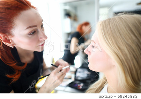 Beauty salon service, stylish applying makeup 69245835